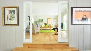 brown coffee table on green area rug
