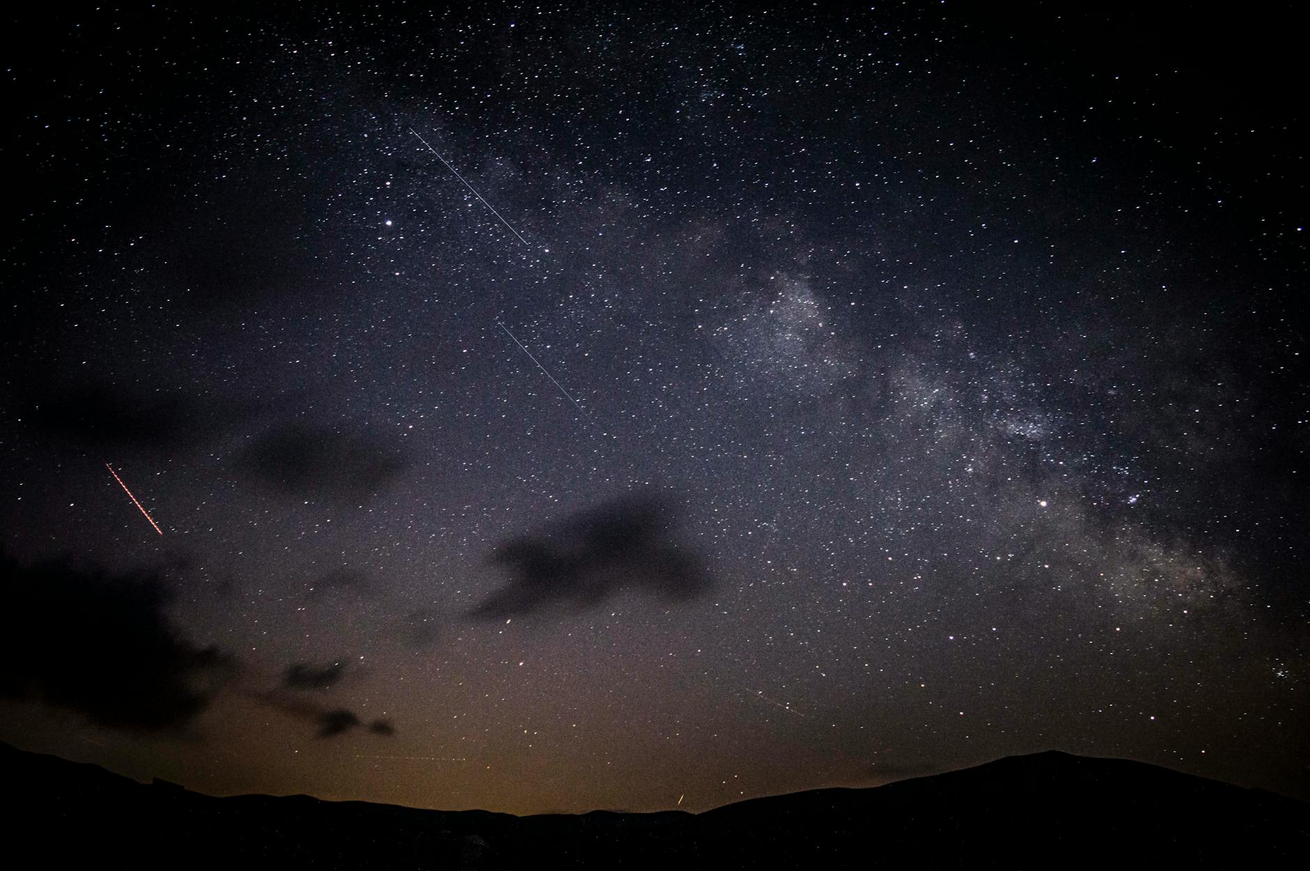 photo of shooting stars during nighttime