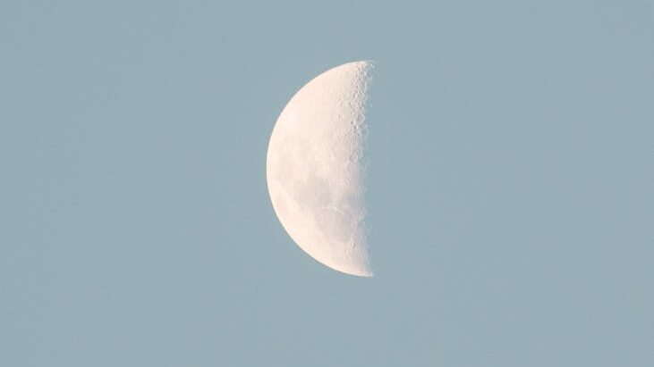 a half moon in the sky
