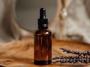 black glass bottle on brown wooden plate